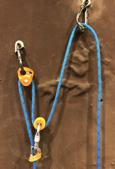 [A collection of pulleys - DMM revolver, Petzl MicroTraxion and Petzl Ultralegere]